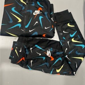 Nike Kids' Black Joggers with Multicolor Swoosh Design 7